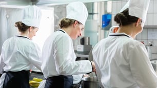 female chefs working in commercial kitchen