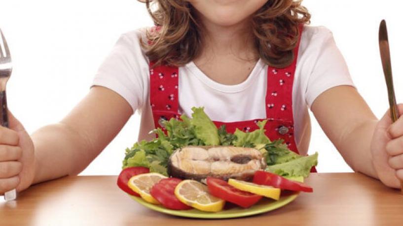 A woman eating fish